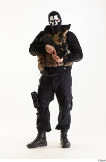 Arthur Fuller Contractor in Mask holding gun standing whole body…